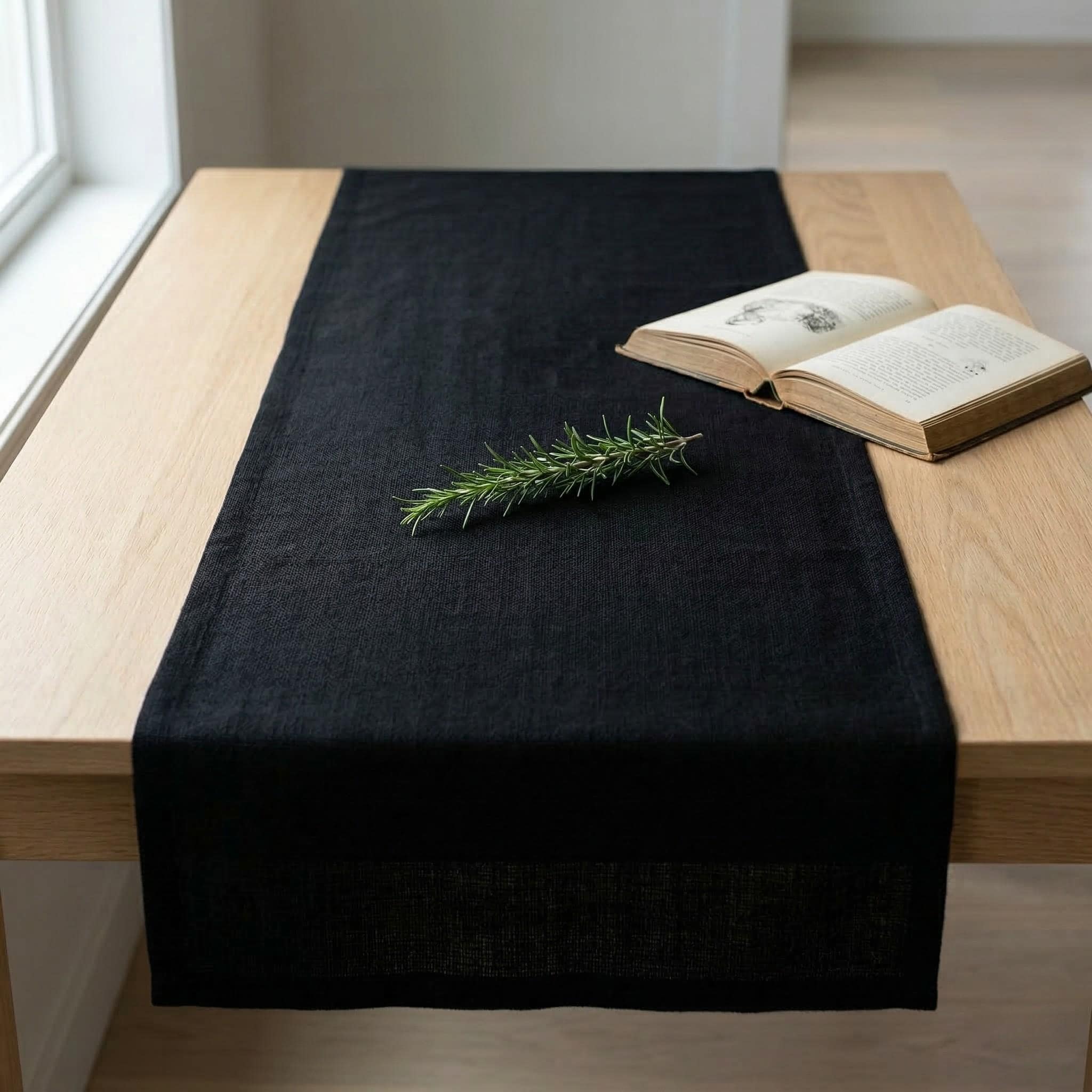 Black linen table runner on dining table