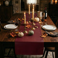 Bordeaux faux leather table runner with autumn pumpkin decor