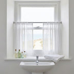Tulle curtain in window