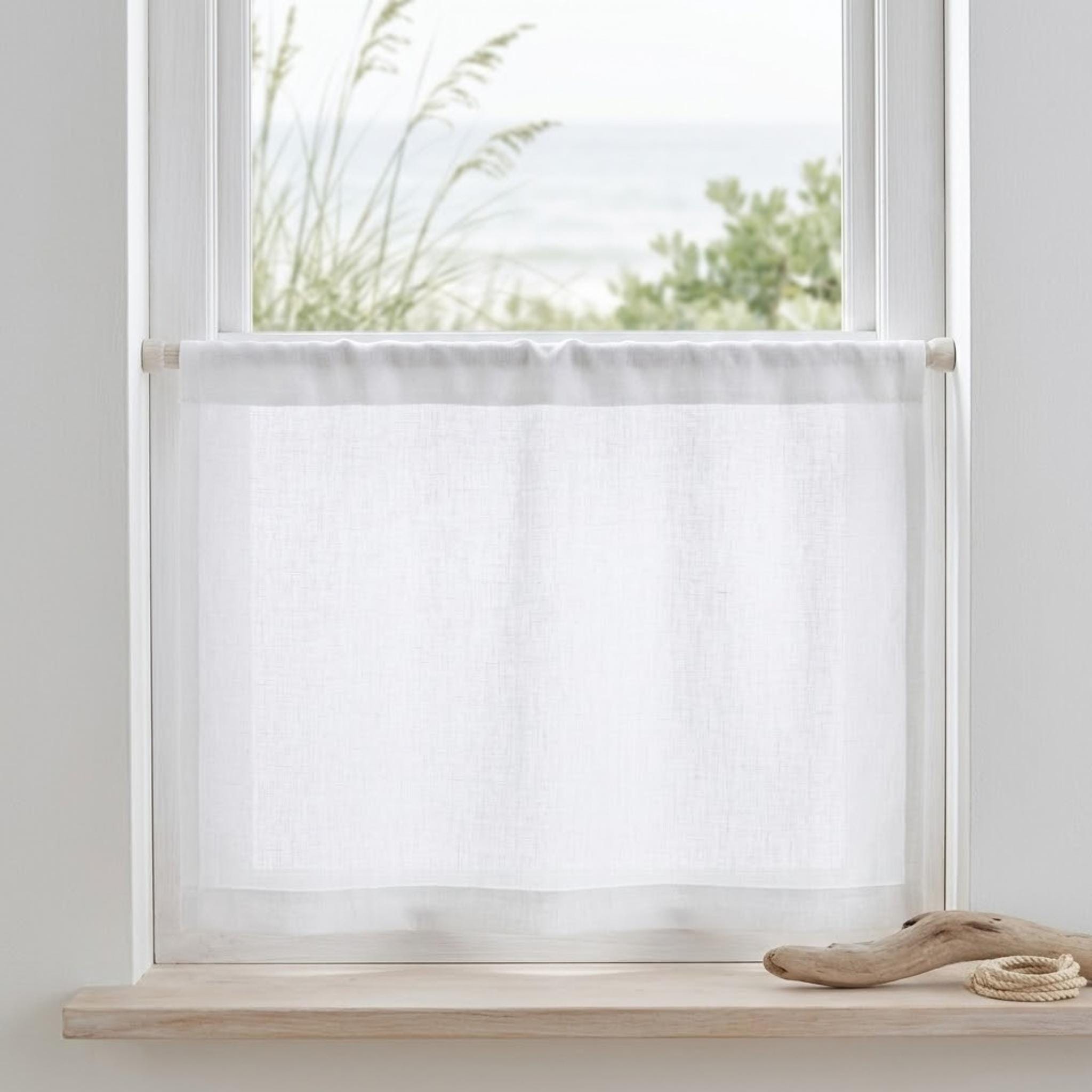 Kitchen window with linen cafe curtain