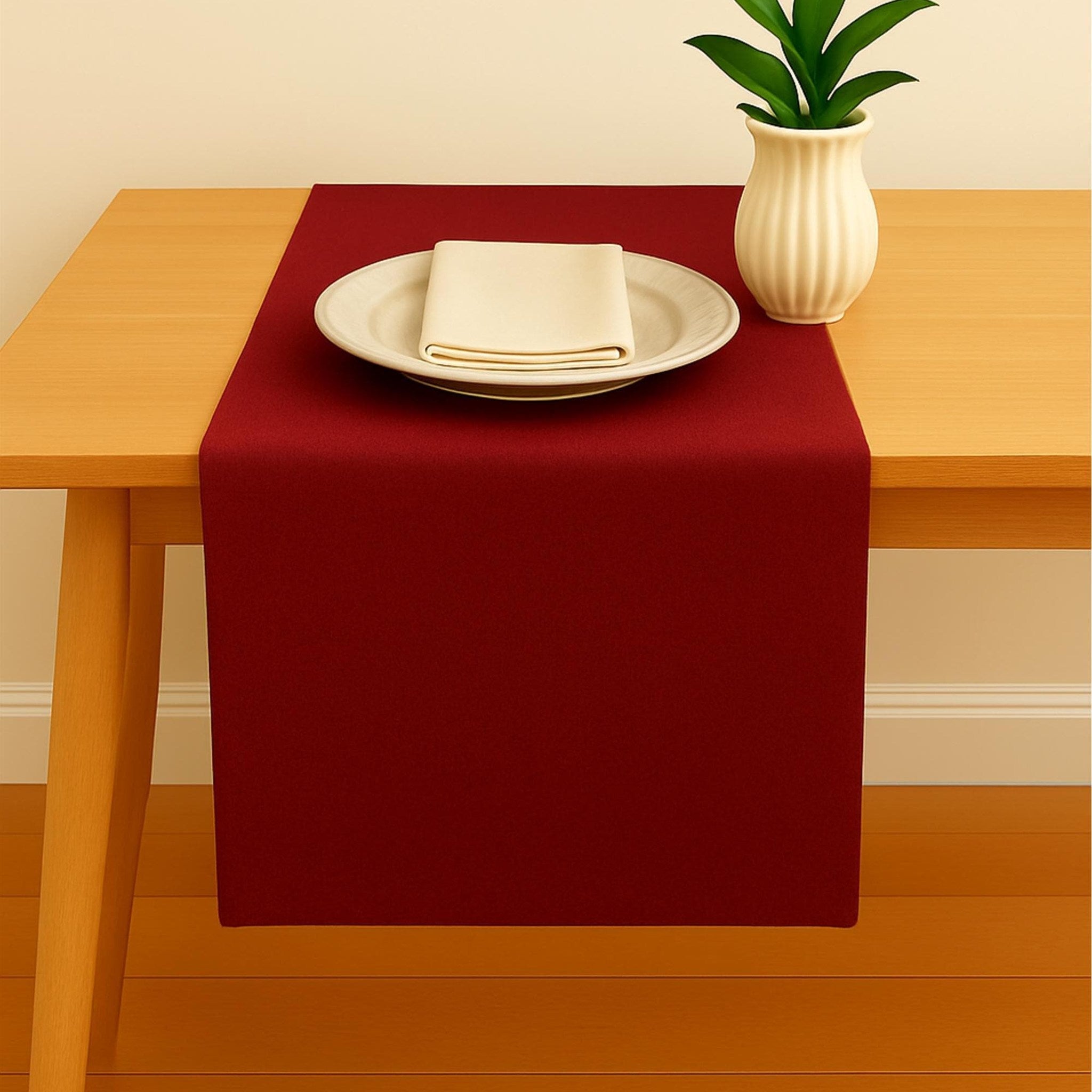 Red linen table runner with plate setting