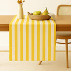 Yellow striped cotton table runner on dining table