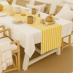 Striped cotton table runner styled with white tablecloth